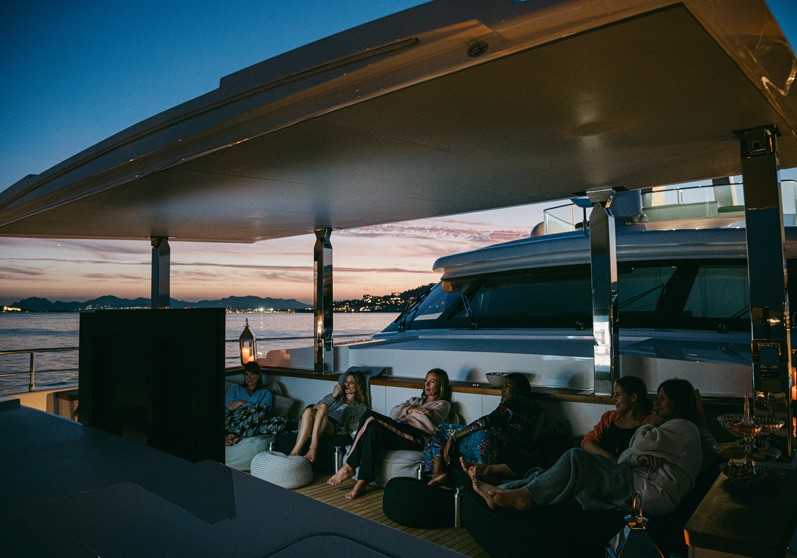 guests enjoying a movie outdoors on a yacht charter holiday
